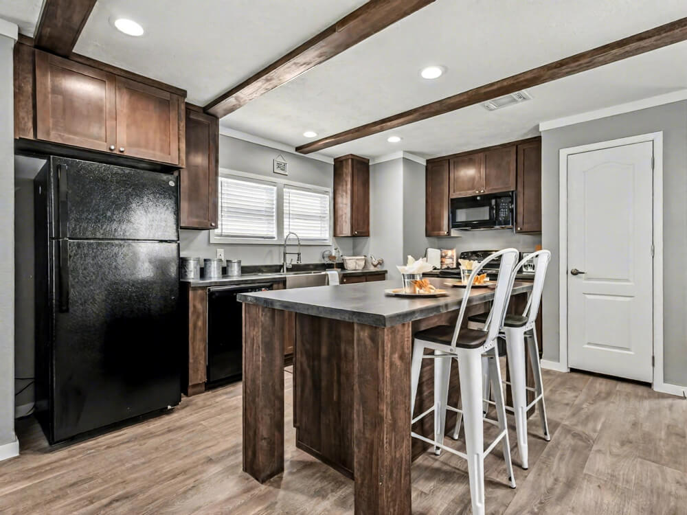 The Declaration by New Vision Manufacturing Kitchen island of The Declaration - 16x76 3 Bedroom Home for Sale